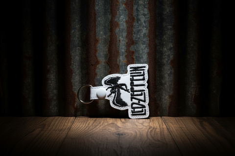 Rock Band-Inspired Angel Keychain – White Faux Leather with Embroidered Design