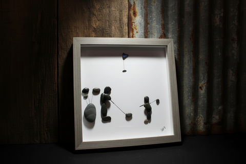 A Man and Son on the COurse Pebble and Stone ARt by at by Amy