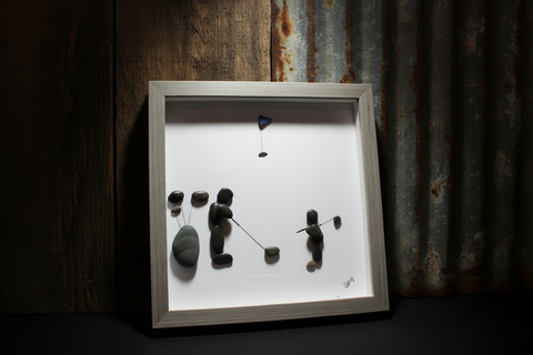 A Man and Son on the COurse Pebble and Stone ARt by at by Amy
