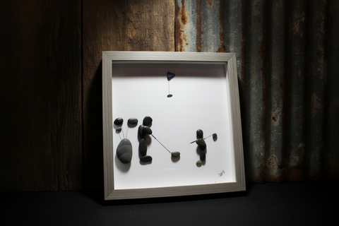 A Man and Son on the COurse Pebble and Stone ARt by at by Amy