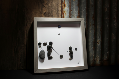 A Man and Son on the COurse Pebble and Stone ARt by at by Amy