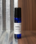 Roll-on bottle with a label on a dark background