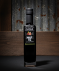 Bottle of Olivelle Harvest Fig olive oil on a dark background