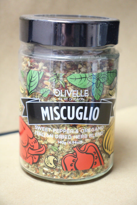 Container of 'Olivelle' organic mixed herbs on a beige background