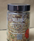 Jar of Italian herb mix with label on a beige background