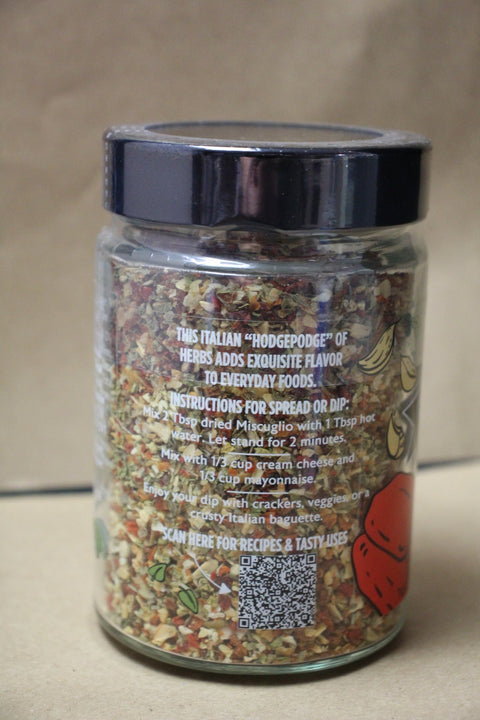 Jar of Italian herb mix with label on a beige background