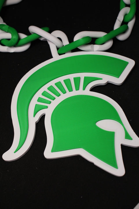 Green Spartan helmet logo on a black background