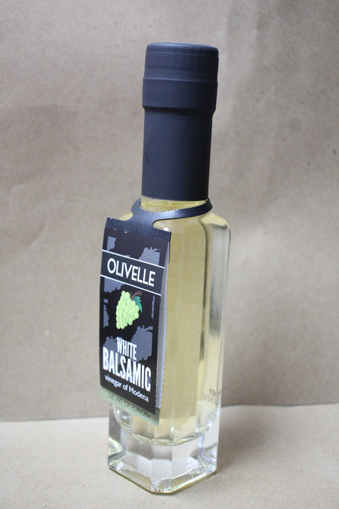 Bottle of Olivelle White Balsamic on a neutral background