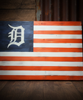 Wooden flag with American design and 'D' logo on a wooden background