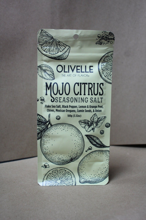 Olivelle Mojo Citrus seasoning salt packaging on a brown background