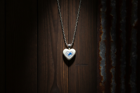 Heart-Shaped Ceramic Pendant with Blue Lion Design on Black Cord Necklace