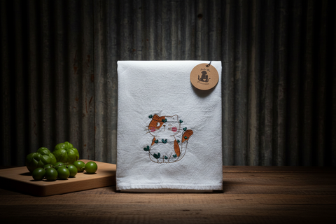 White Tea Towel with Embroidered Cat and Heart Vine Design