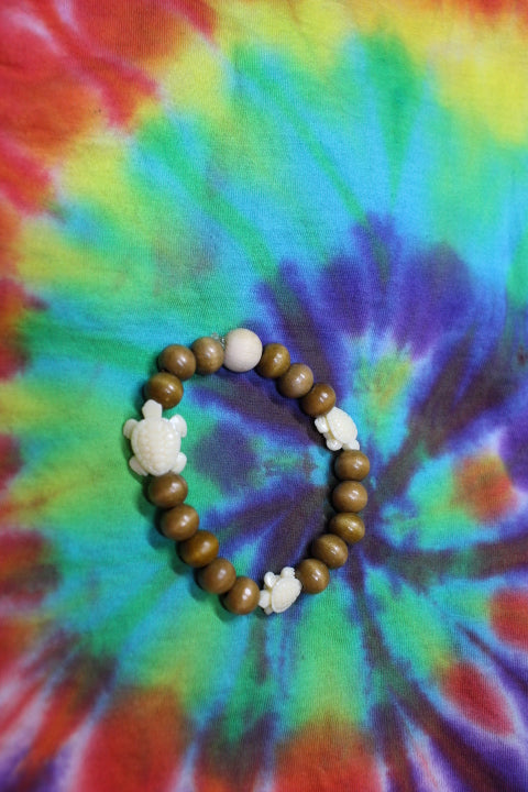 Ivory Turtle w/Tan and Lt Brown Wood Beads By Bracelet Theiss Tye Dye Studios