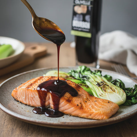 Bottle of Olivelle Bourbon barrel aged balsamic on a beige background