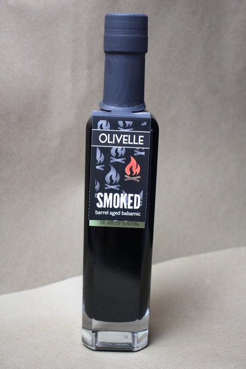 Bottle of Olivelle Smoked barrel aged balsamic on a neutral background