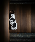 Keychain with a logo on a wooden surface