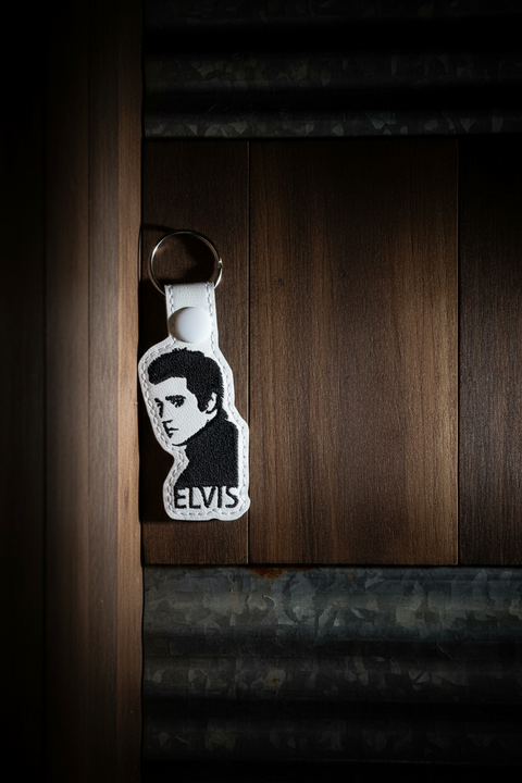Keychain with a logo on a wooden surface