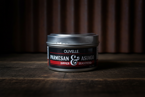 Olivelle Parmesan & Asiago Dipper Seasoning container on a wooden surface with a dark background