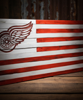 Wooden flag with a red and white design on a wooden surface