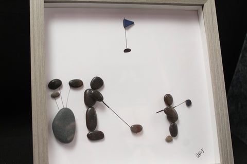 A Man and Son on the COurse Pebble and Stone ARt by at by Amy