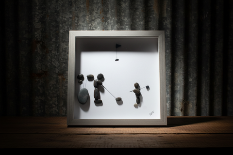 A Man and Son on the COurse Pebble and Stone ARt by at by Amy