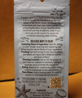 Back of a seafood package with text and QR code on an orange background