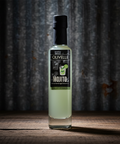 Bottle of Olivelle Mojito on a wooden surface with a dark background