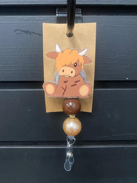 Cow Badge Reel by June Bugs